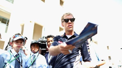 A reader says some Formula One drivers disappointed many fans who spent hours standing in the queue on Thursday to get their autographs. Above, Sebastian Vettel signs autographs for young fans. Clive Mason / Getty Images