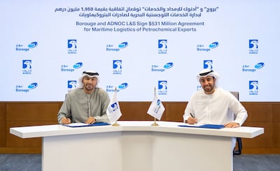 From left, Abdulkareem Al Masabi, chief executive of Adnoc L&S, and Hazeem Al Suwaidi, chief executive of Borouge, during a signing ceremony. Photo: Adnoc L&S