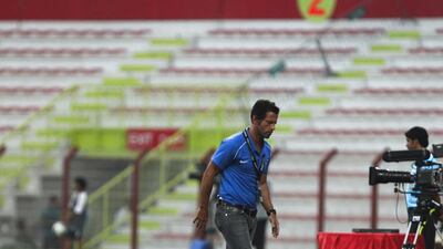 Al Ahli head coach Enrique Sanchez Flores frustratedly paces the touchline. Lee Hoagland/The National