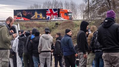 Migrants queue for hot meals from the Salam Charity aid agency in Dunkirk, France. Bloomberg