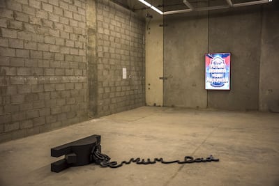 We Are Not Alone featuring Bill Woodrow's Point of Entry, 1989. British Council Collection © Bill Woodrow (foreground) and Mark Titchner's The Future Demands Your Participation, 2006. British Council Collection. © Mark Titchner / Pedro Masour