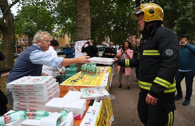 Staff from a local Italian restaurant handed out pizza and water from a stall near Parsons Green tube station. Hannah McKay/Reuters