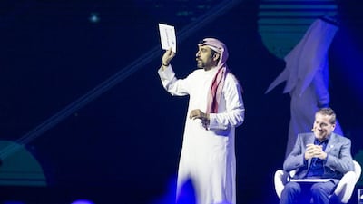 Ahmed Al Shugairi holds up the final results at the ceremony. Reem Mohammed / The National