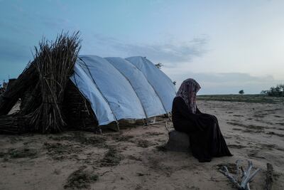 A woman sits by a tent in El Geneina, West Darfur. The UN Security Council referred the situation in Darfur to the ICC in 2015. Reuters