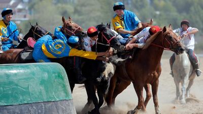 Kazakh and Russian horsemen take part in kok-boru. EPA