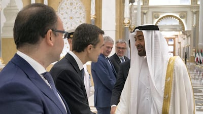 Sheikh Mohamed bin Zayed greets an Italian delegation member during a reception held at the Presidential Palace. Hamad Al Kaabi / Ministry of Presidential Affairs. Hamad Al Kaabi / Ministry of Presidential Affairs