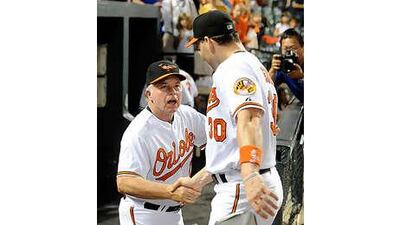 Buck Showalter, left, the Baltimore Orioles coach, has improved the team's results since taking over in May.