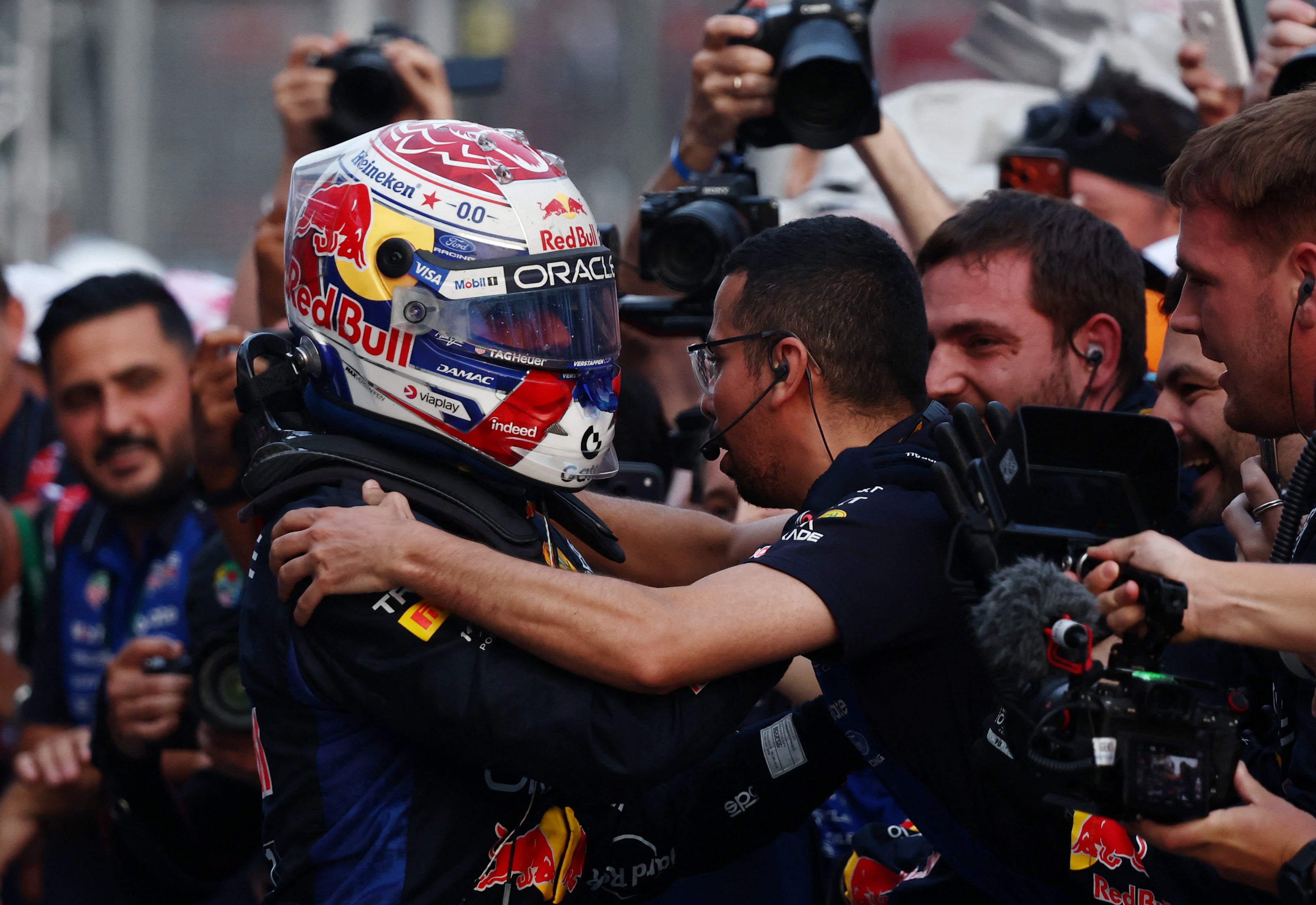Red Bull's Max Verstappen celebrates with his teammates after winning at Sepang International Circuit. Reuters