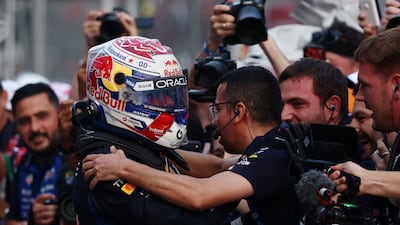 Red Bull's Max Verstappen celebrates with his teammates after winning at Sepang International Circuit. Reuters