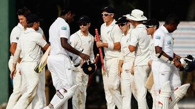 New Zealand cricketers celebrate after winning the second and final Test against Sri Lanka.