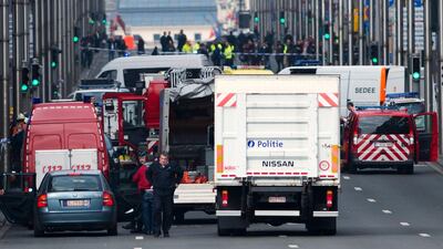 Belgian police and emergency staff arrive in the Wetstraat - Rue de la Loi, which has been evacuated after an explosion at the Maalbeek metro station in Brussels. Laurie Dieffembacq / AFP / Belga