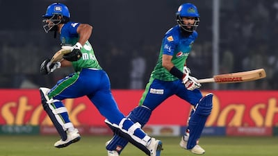 Multan Sultans' Moeen Ali, right, and Shan Masood during the PSL match against Peshawar Zalmi in Multan on February 26, 2020. AFP