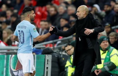 Pep Guardiola, right, has not always appeared Sergio Aguero's biggest fan, but he has an explanation for that. Carl Recine / Reuters