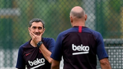 Barcelona's manager Ernesto Valverde, left, lays out markers. AFP