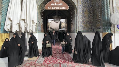 Pilgrims enter the Imam Ali Shrine through Bab al Sa'ah, The Clock Gate. Leila Molana-Allen for The National