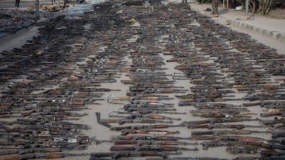 Seized ISIS weapons that were found in the last stronghold of the extremist group are displayed at an SDF base outside Al Mayadin, Syria. Getty
