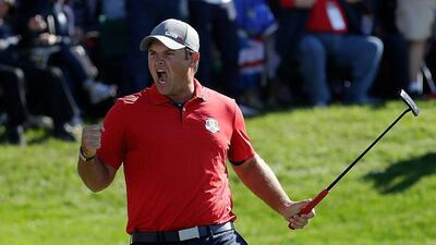 Patrick Reed of the United States reacts after making a putt on the 16th green to end the match during morning foursome matches on Day 1 of the 2016 Ryder Cup. Jamie Squire / Getty Images / AFP / September 30, 2016
