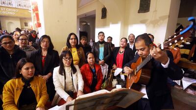 Catholics sing carols as they attend Christmas celebrations at the Saint Francis Catholic Church in the Dahra district of the Libyan capital Tripoli. AFP