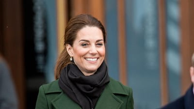 Wrapped up for a chilly public visit to Blackpool on March 6, Kate wears a moss Sportmax coat with a forest-green, top-handle bag from Turkish label Manu Atelier. EPA