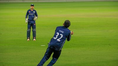 Hamza Tahir takes the match-winning catch for Scotland against Oman. Photo: ICC