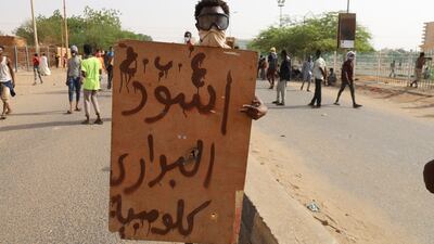 A protester holds a placard reading 'Barari Lions'. Reuters