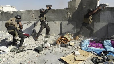 Iraqi Special Operations Forces clash with ISIL fighters in Ramadi in 2014. Stringer / Reuters