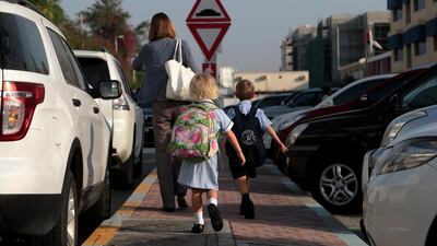 Parents drop their children off at school in Abu Dhabi. Christopher Pike / The National