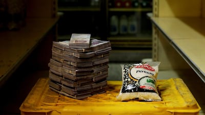 A packet of rice is pictured next to 2,500,000 bolivars