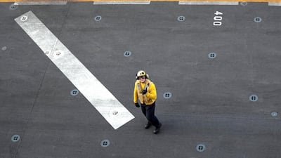 A US sailor is seen on the deck.