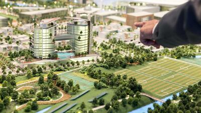 Above, Dubai South’s The Village model at Cityscape Global 2015. Reem Mohammed / The National
