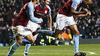 Zat Knight, right, was the unlikely hero as Aston Villa fought back from 2-0 down to share the points with Arsenal