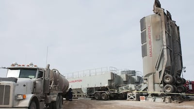 Halliburton trailers, which store sand for hydraulic fracturing, stand at a Hess well site near Williston, North Dakota. the oilfield services firm has beaten profit estimates. Andrew Cullen / Reuters