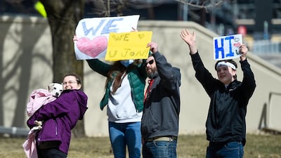 Members of the Baden family from Coon Rapids, Minnesota, wave to their father and grandfather, John Baden, from the street because they are not allowed in his hospital room during the pandemic while he's being treated at the Hennepin County Medical Center for issues not related to Covid-19 in Minneapolis, Minnesota, USA. EPA