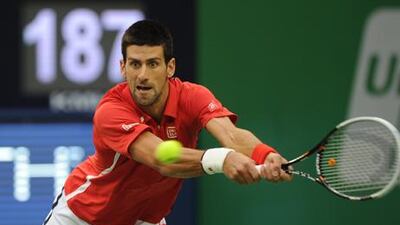 Novak Djokovic returns a shot to Andy Murray in the Shanghai Masters final