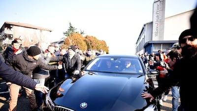 AC Milan forward Zlatan Ibrahimovic surrounded by supporters after his arrival. AFP