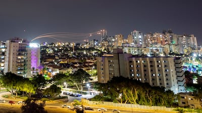 Israel's Iron Dome system intercepts rockets launched from Gaza, as seen from Ashkelon. The US is targeting Hamas funding with sanctions. Reuters