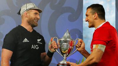 New Zealand's Kieran Read, left, and Lions' Sam Warburton with the trophy after the match.