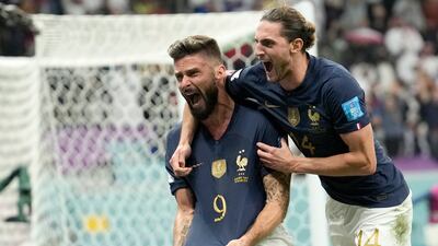 Olivier Giroud, left, celebrates with Adrien Rabiot after scoring France's winner. AP