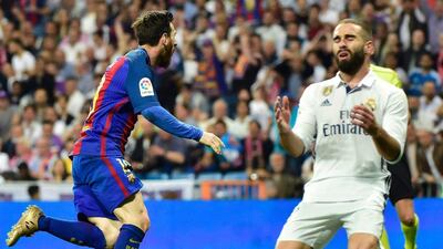 Messi, left, celebrates his 500th career Barceloan goal, having scored No 499 earlier in the match. Gerard Julien / AFP