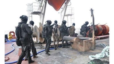 Captured Somali pirates are led away by soldiers of the UAE Special Forces. Readers advocate tough measures against piracy. Courtesy of UAE Armed Forces