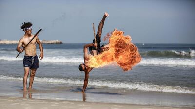 A fire-breathing performance in Gaza. Photo by Majd Mahmoud