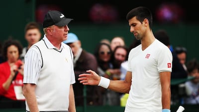 Novak Djokovic talks with coach Boris Becker on Saturday as he trains for Sunday's 2014 Wimbledon men's singles final against Roger Federer. Jan Kruger / Getty Images
