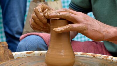 A laborer works at a traditional clay pots during Cherry Day in the village of Hammana, southeast of Beirut, Lebanon. EPA