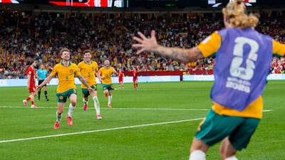 Connor Metcalfe (No 8) celebrates after scoring for Australia in the second half during their Group D match against Turkey, in Vancouver. The Socceroos won 2-0. EPA