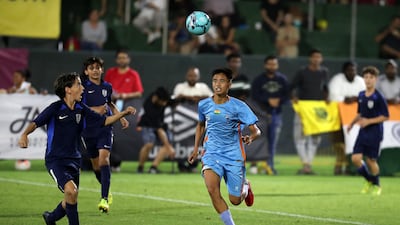 Players of Minerva Academy (light blue) and La Liga Academy contest the ball.