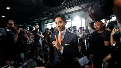 Move Forward Party chief Pita Limjaroenrat poses for pictures in Bangkok after taking the lead in Thailand's election. EPA