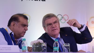 International Olympic Committee president Thomas Bach, right, said the IOC had “put ourselves into the shoes” of athletes who would want the Russian appeal victories evaluated again. AFP/Dominique FAGET