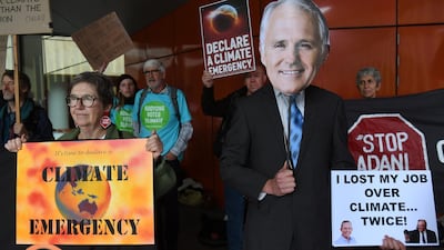 A protester wearing a mask of former Liberal prime minister Malcolm Turnbull demonstrates outside the Liberal Party's campaign launch in Melbourne. AFP