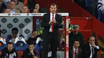 Brendan Rodgers is hoping for some help this weekend. Adrian Dennis / AFP