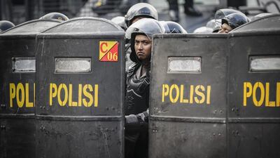 Indonesian riot police officers stand guard on November 4, 2016, during a protest against allegedly blasphemous remarks made by Jakarta’s Governor Basuki Tjahaja Purnama, popularly known as ‘Ahok’ outside the presidential palace in Jakarta, Indonesia. Mast Irham / EPA